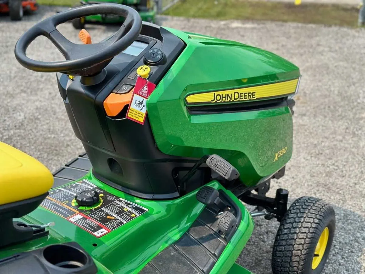 john deere d110 vs x330 specs